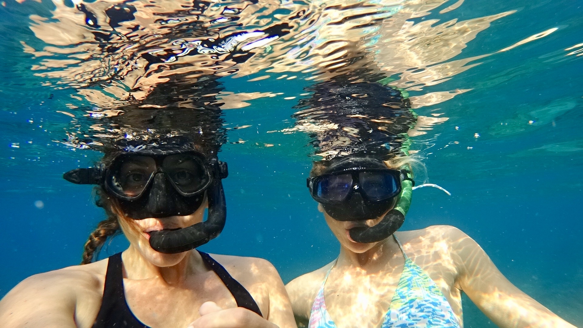 Two mermaids enjoying beautiful Amed Bali