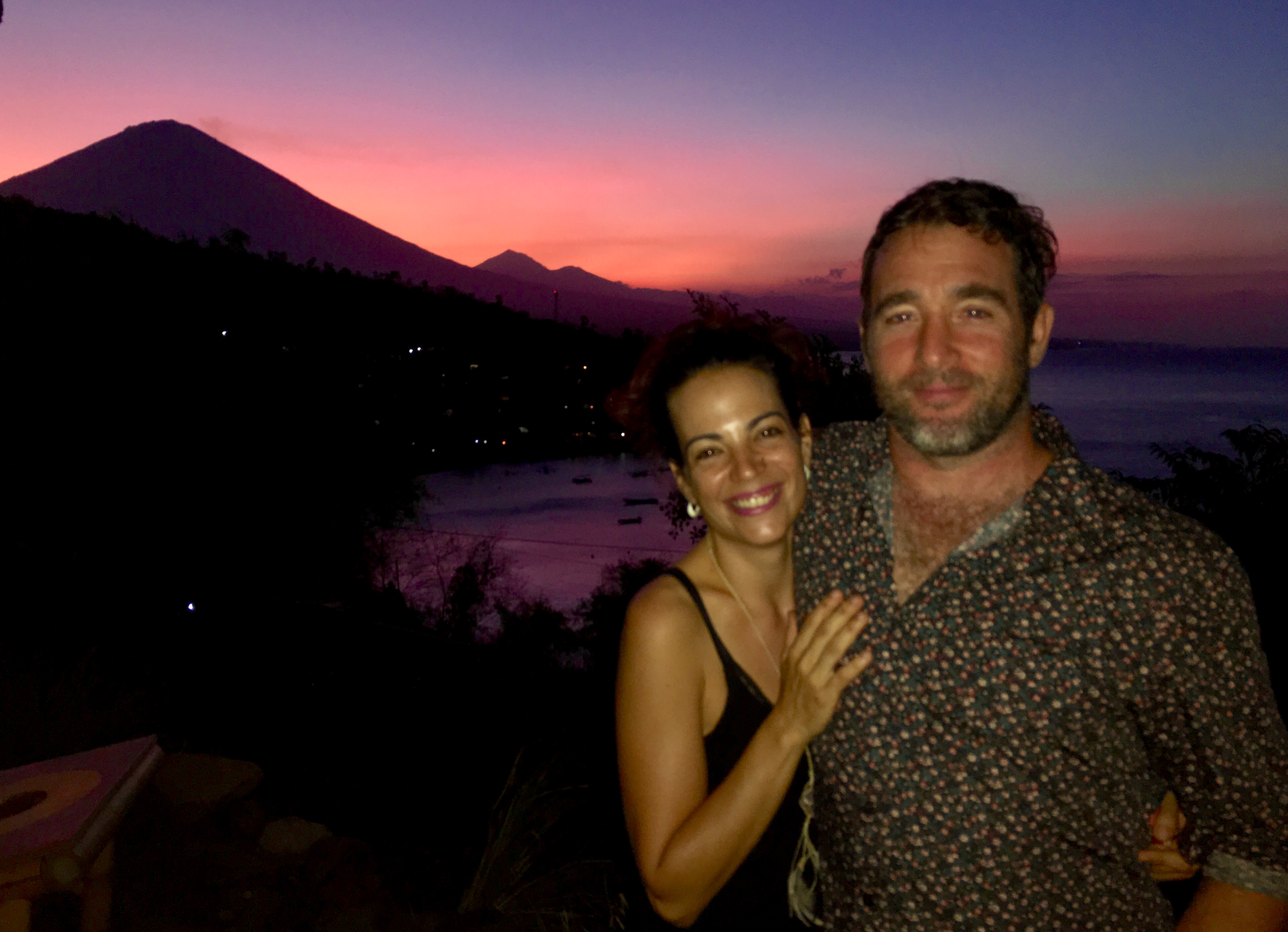 Beautiful couple enjoying sunset behind Mt. Agung in Amed Bali, Blue Earth Village